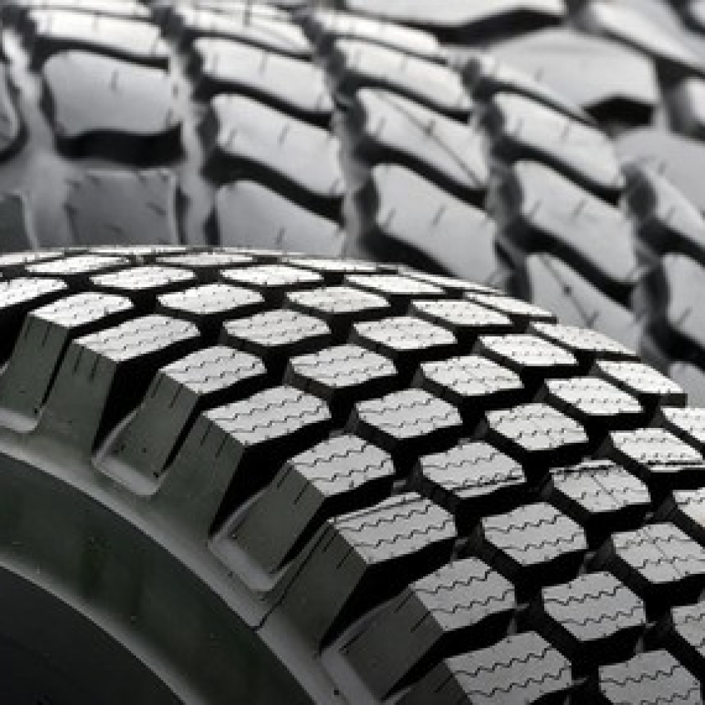 Close-up of truck tires showcasing tread patterns and surface details.